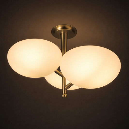 Ceiling light fixture with three glass shades on a dark background