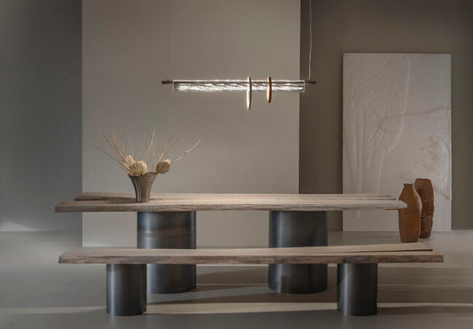 Modern dining table with a minimalist design in a neutral-colored room.