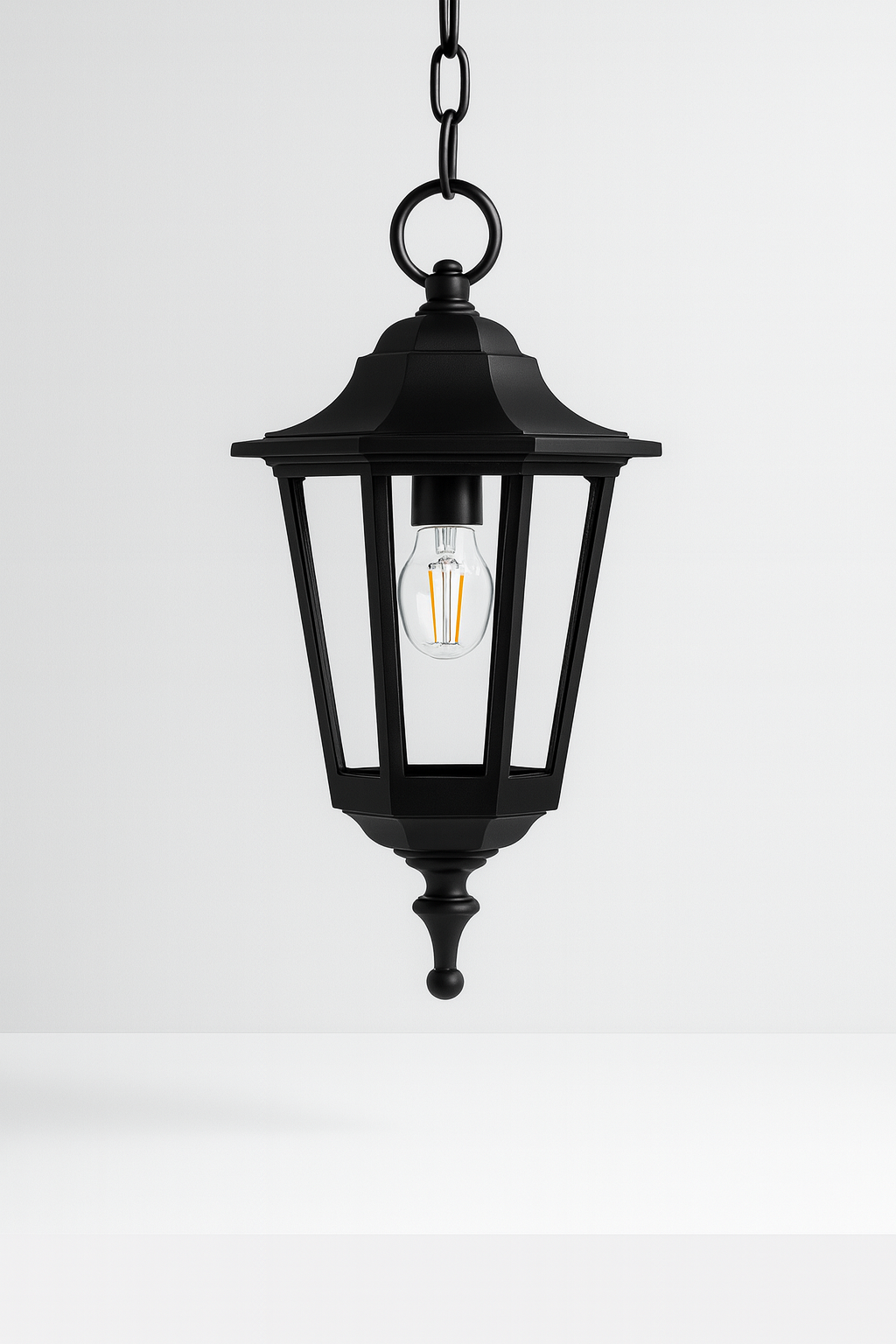 Black outdoor hanging lantern with a visible E27 base lamp