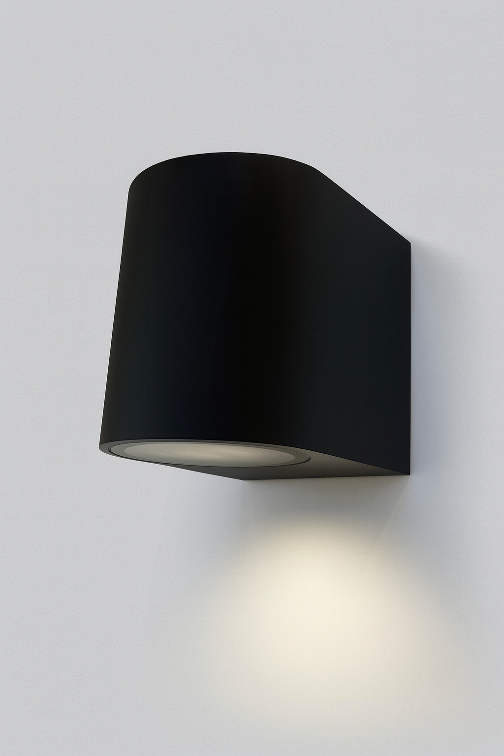 Black wall-mounted light fixture with GU10 base lamp