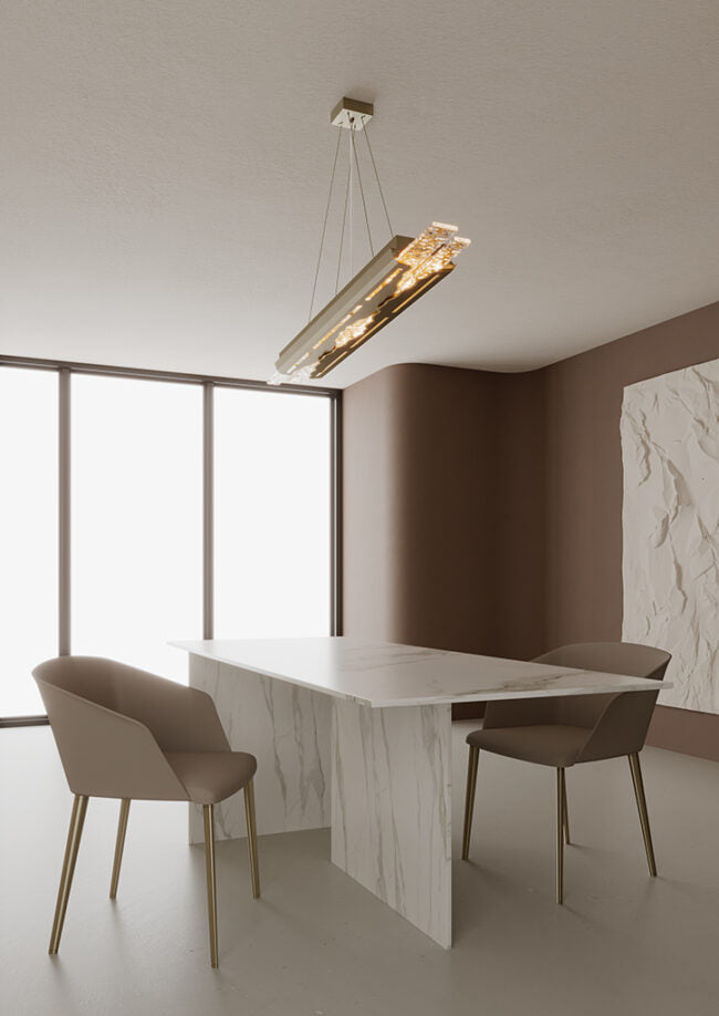 Modern dining area with a white marble table and chairs, featuring a ceiling light fixture.