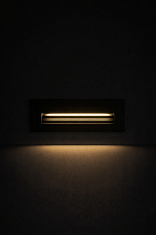 Modern outdoor light fixture on a dark wall