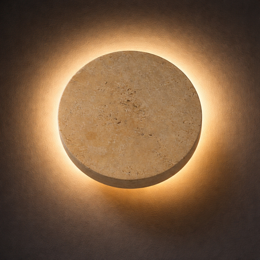 Round stone wall light fixture on a dark background