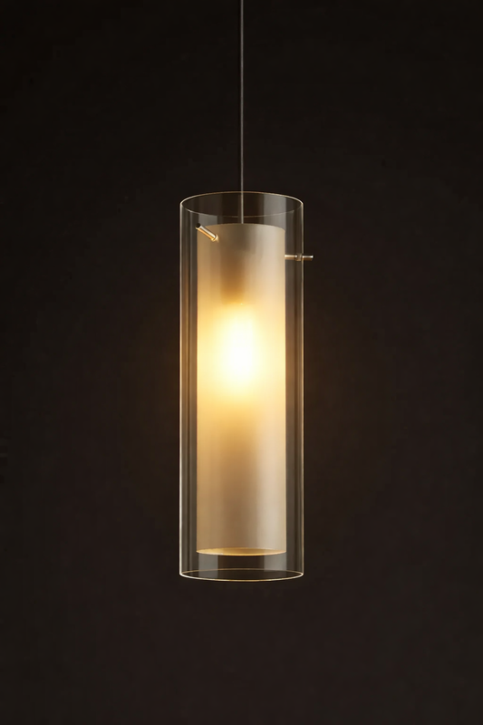 Cylindrical pendant light with a clear glass shade on a black background