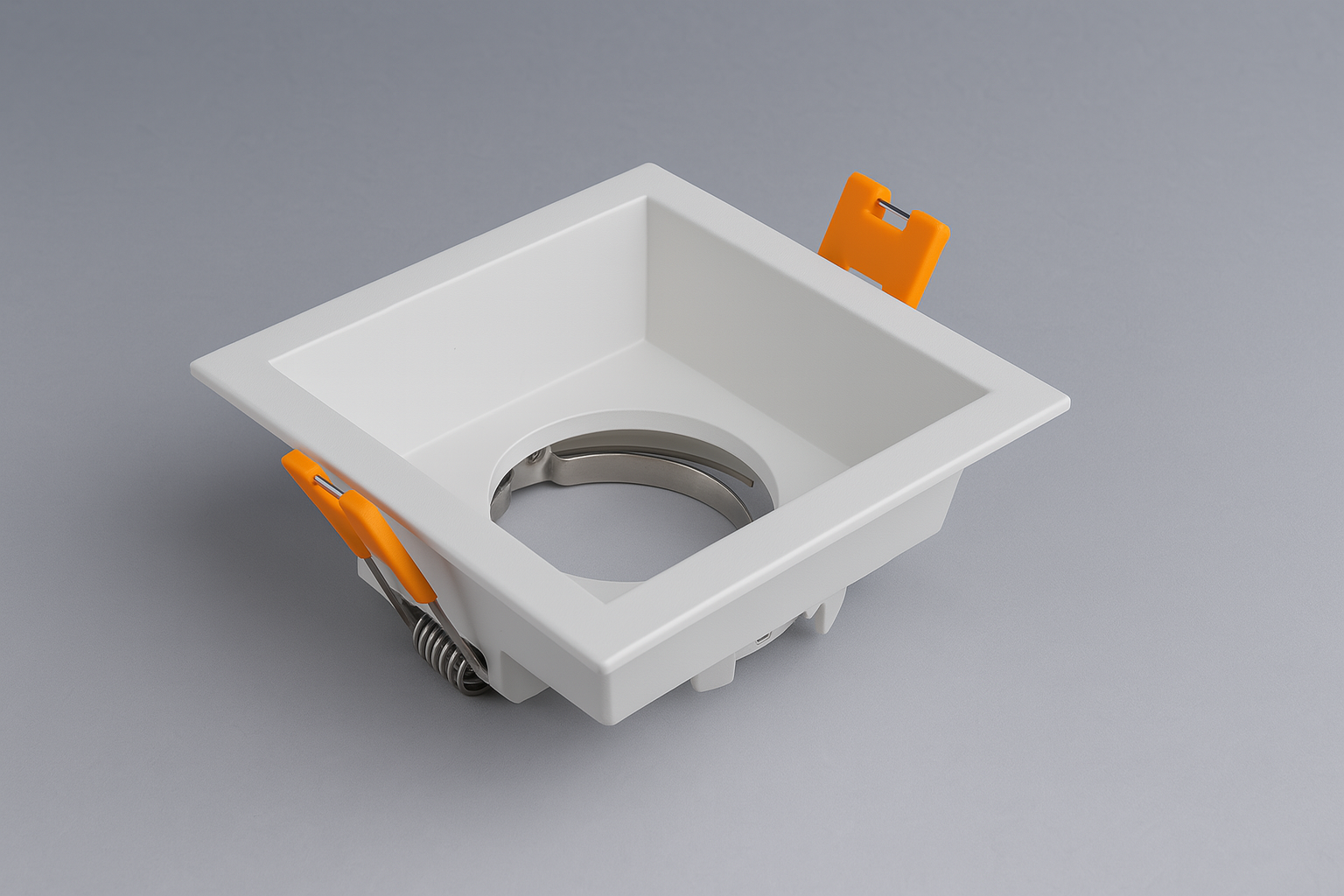 Square recessed spotlight with orange mounting tabs