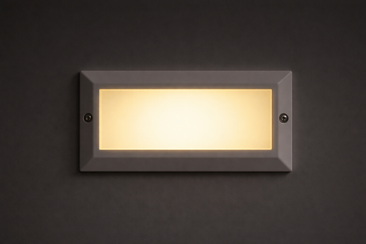 Rectangular LED outdoor light fixture on a dark background