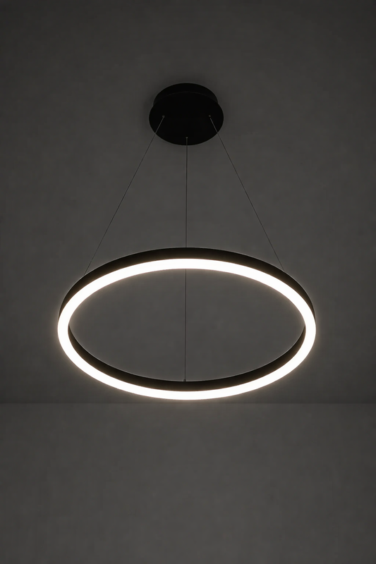 Modern pendant light with circular design on a plain background