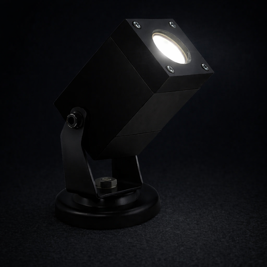 Black outdoor spotlight on a dark background