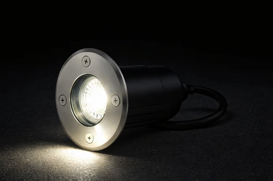 In-ground light fixture on a dark background