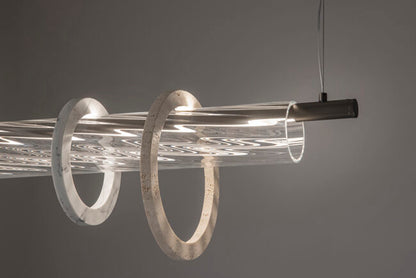 Modern pendant light with circular design on a gray background