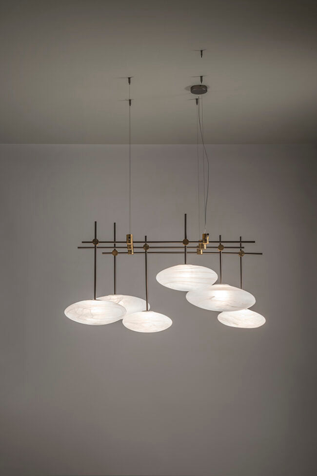 Modern chandelier with multiple round lights on a gray background