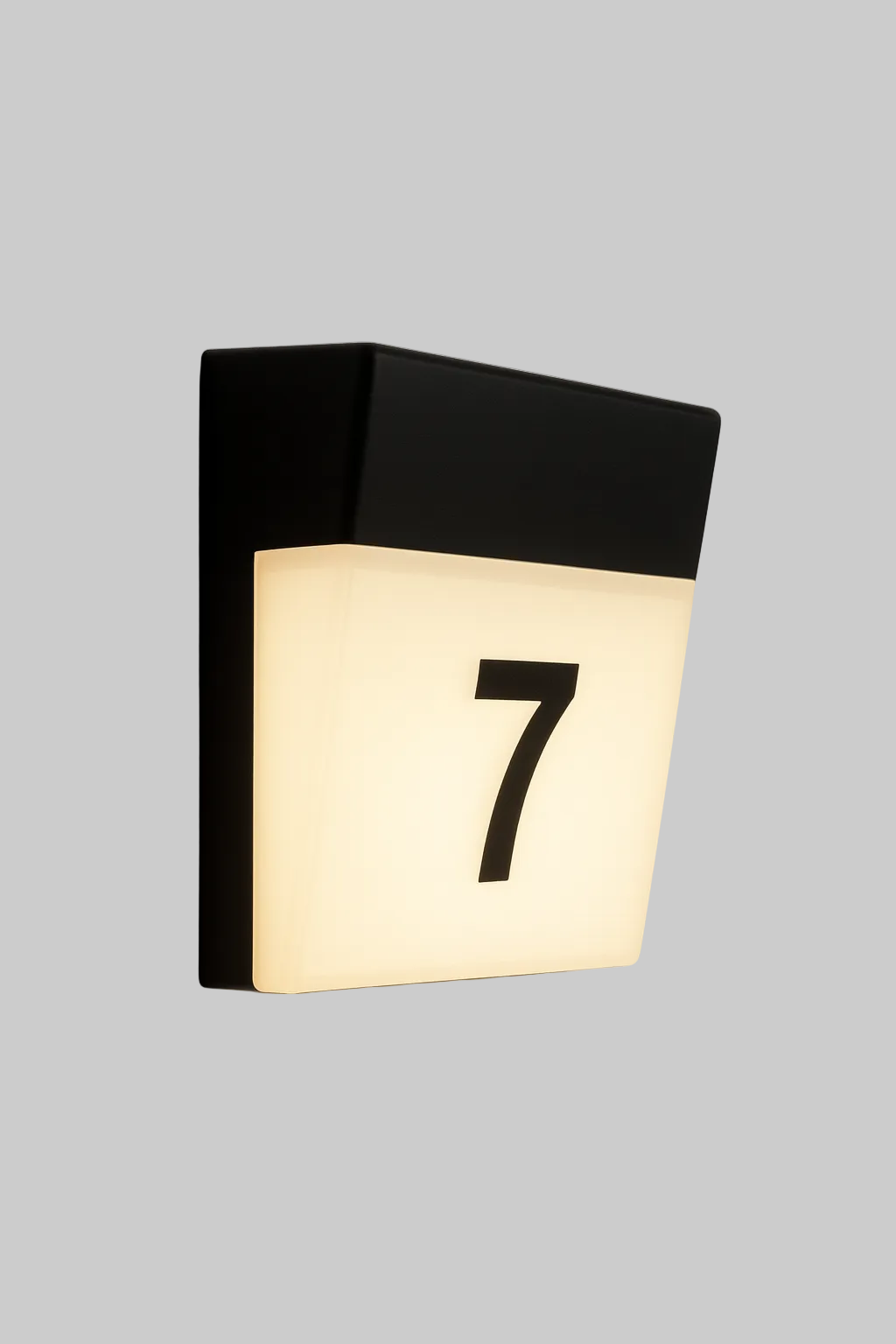 Modern wall light fixture with number '7' on a gray background