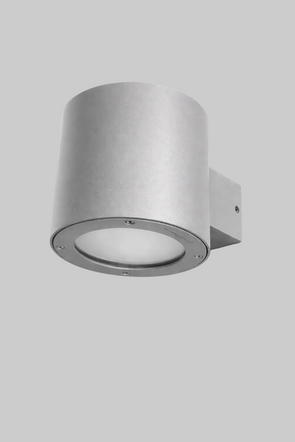 Silver cylindrical wall light fixture on a white background