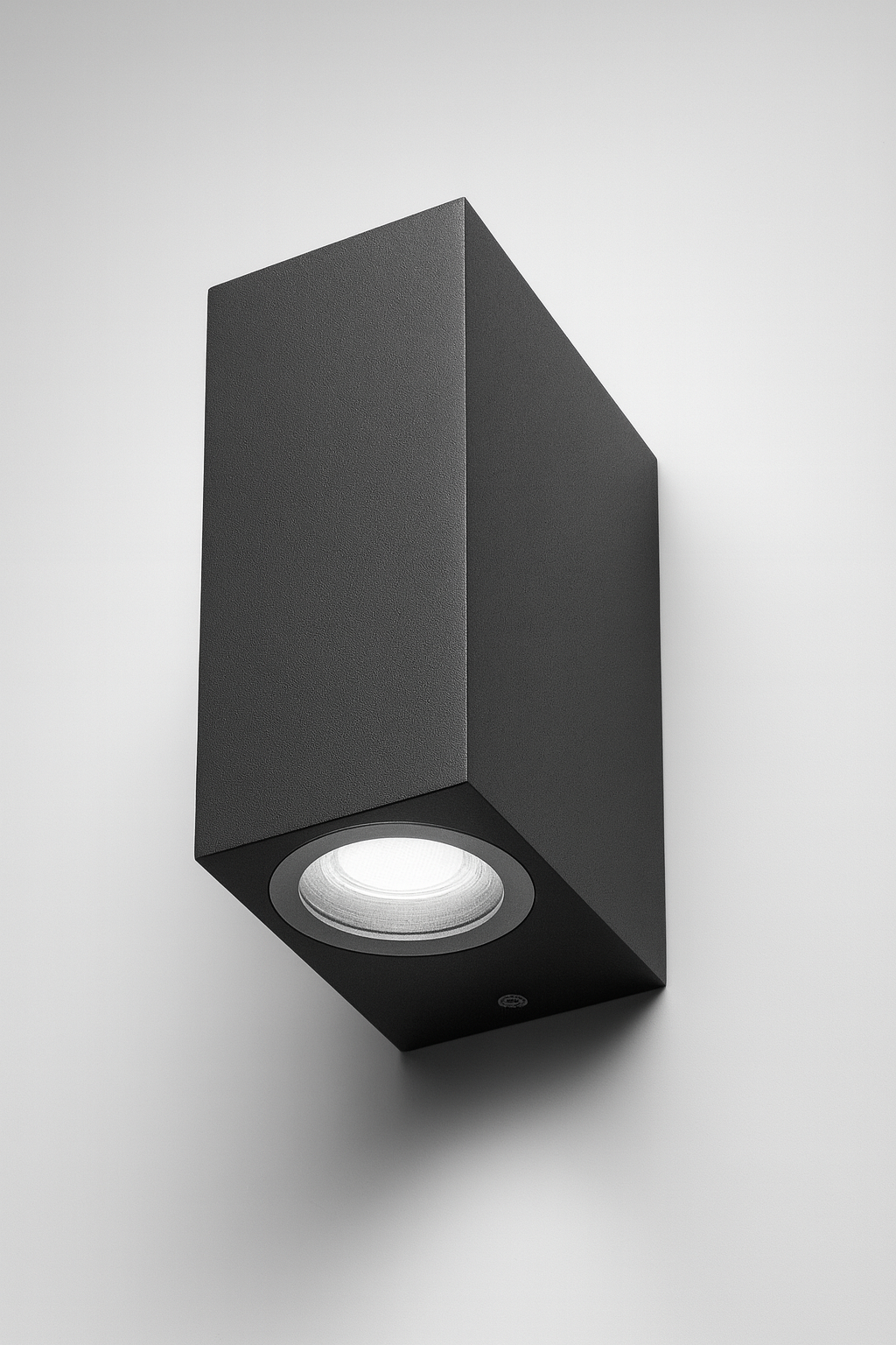 Black square wall light fixture with GU10 base lamp