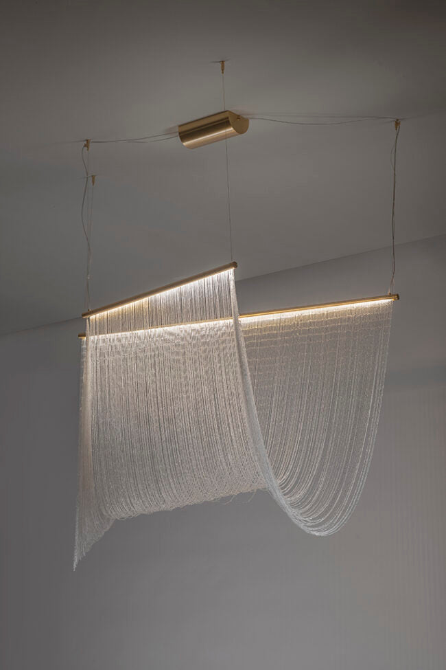 Modern chandelier with a geometric design on a plain background