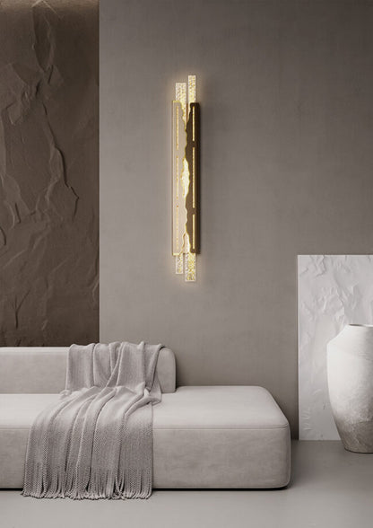Modern wall sconce in a living room setting with a neutral color palette.