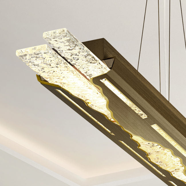 Modern pendant light fixture with a textured design on a neutral background