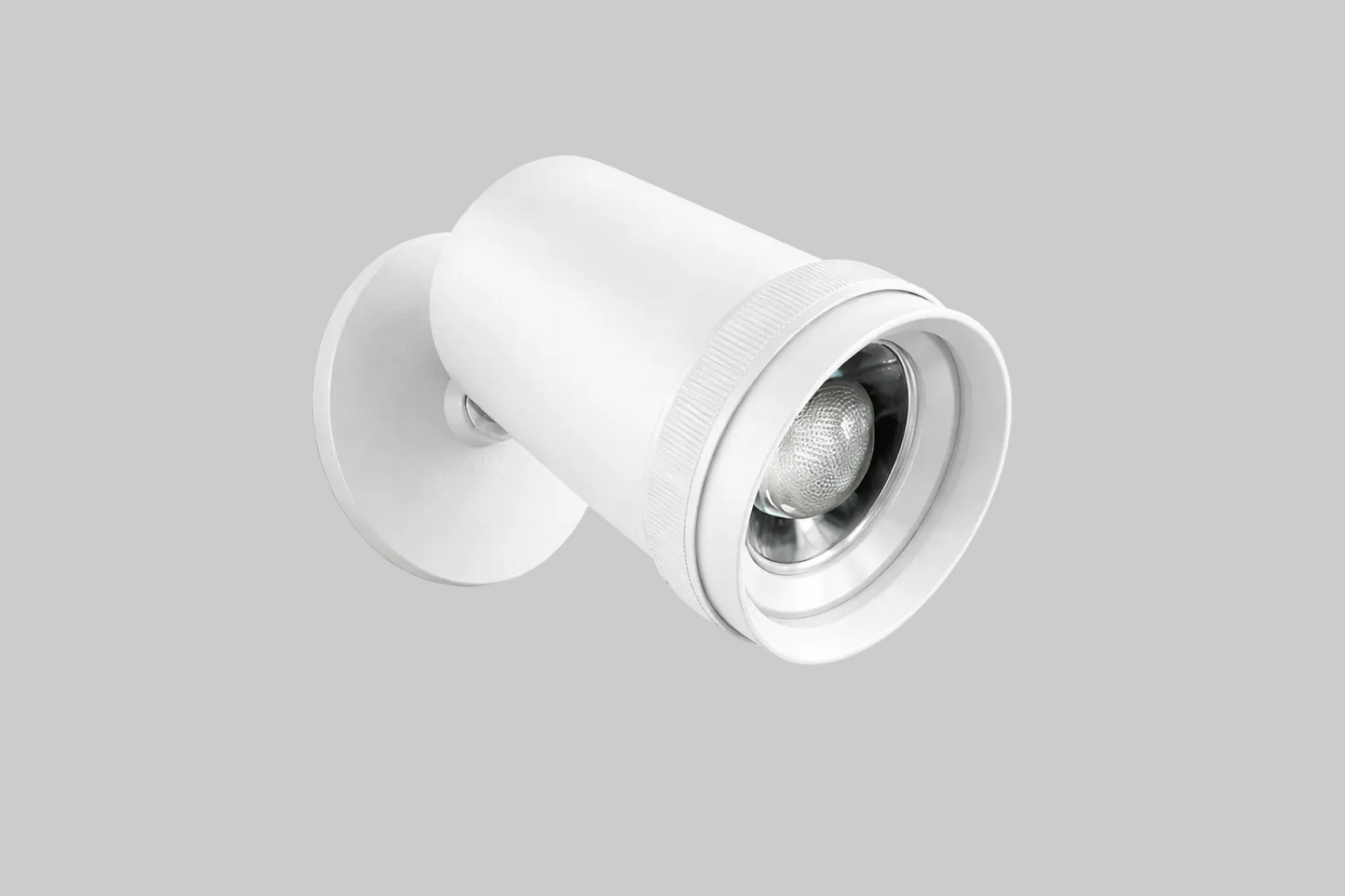 White wall-mounted light fixture on a gray background