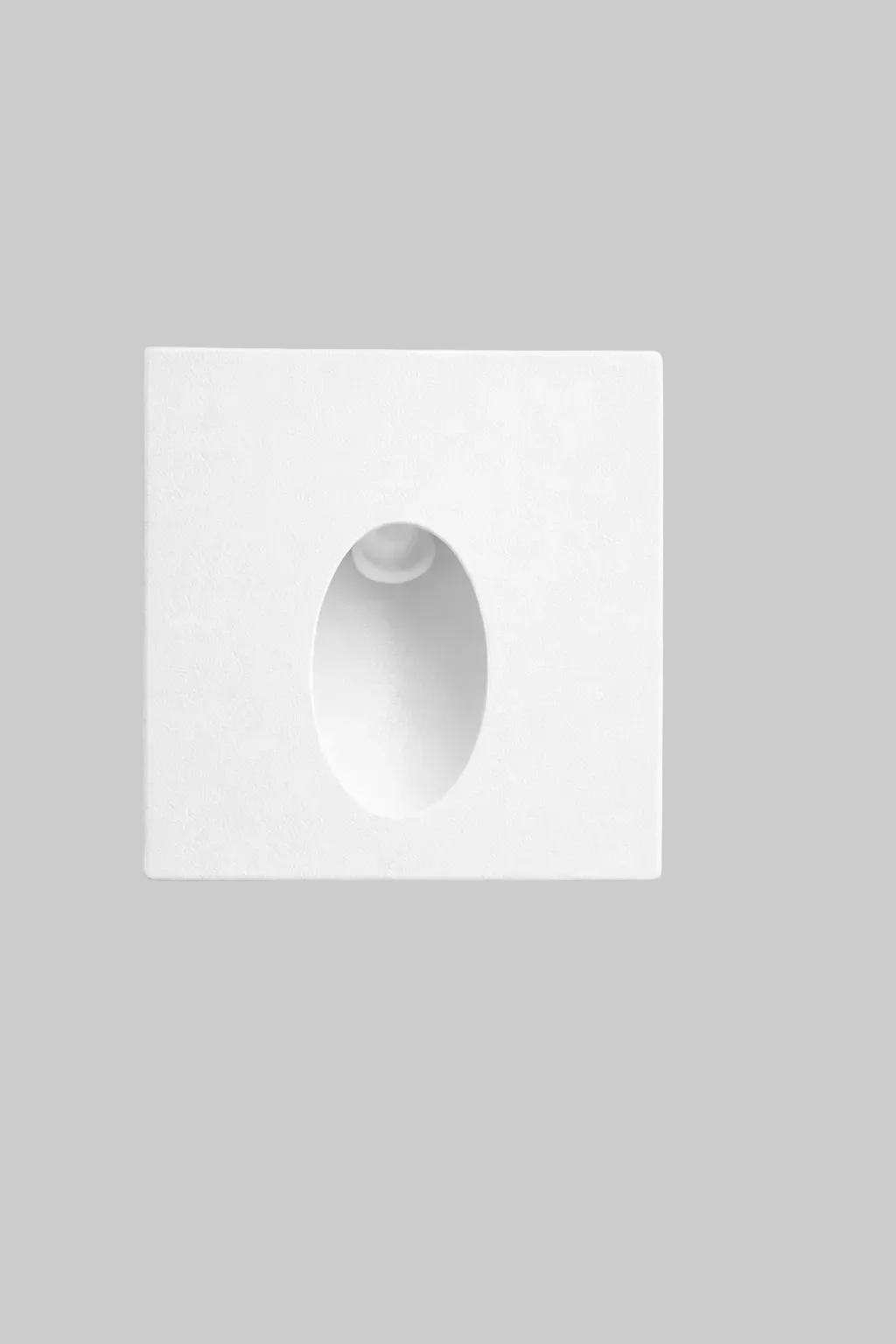 White square wall art with a central oval cutout on a light gray background