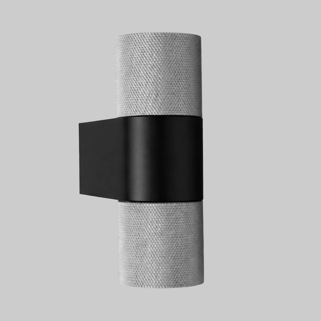 Wall-mounted light fixture with black and silver design on a white background
