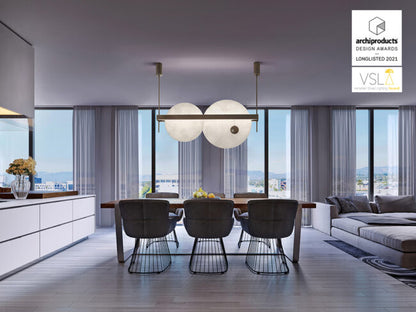 Modern living room with a dining table and chairs, featuring a design award logo.