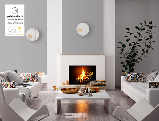 Modern living room with a fireplace, white walls, and decorative elements.