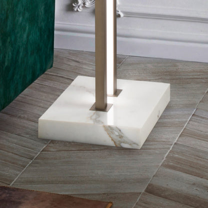 Marble base of a lamp on a wooden floor