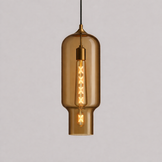 Amber yellow glass pendant light with visible filament on a gray background