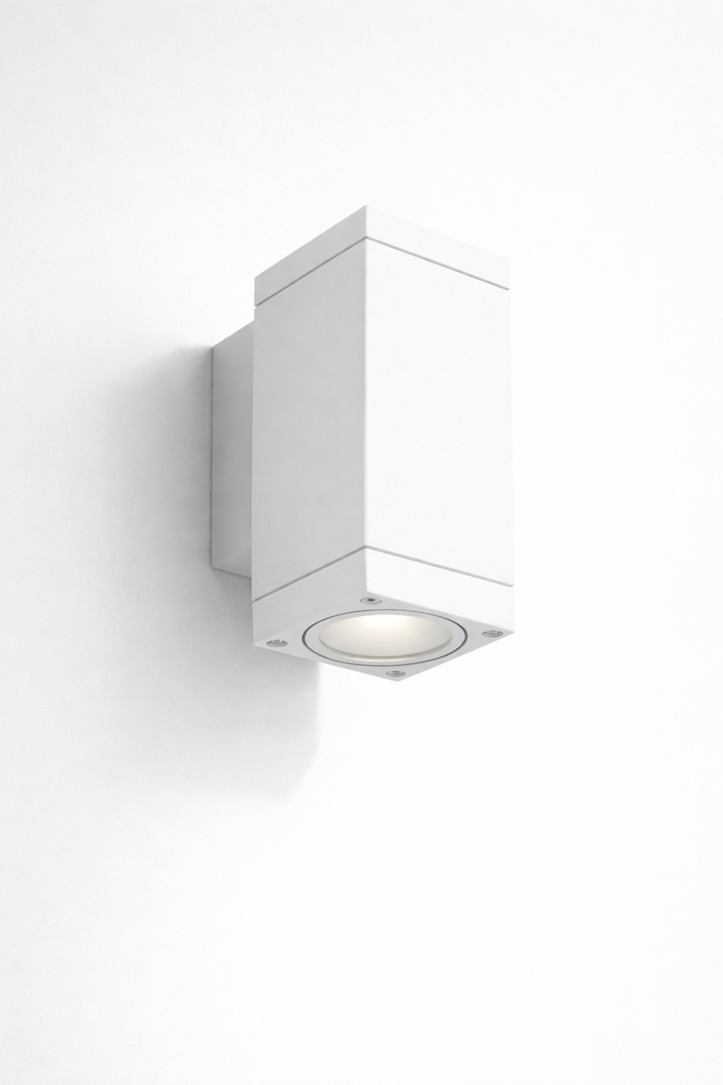 White mounted wall light fixture in a modern outdoor area 