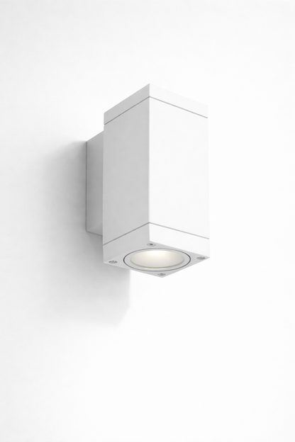 White mounted wall light fixture in a modern outdoor area 