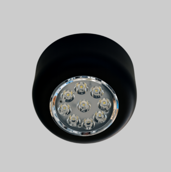 Black spotlight with clear glass cover on a gray background