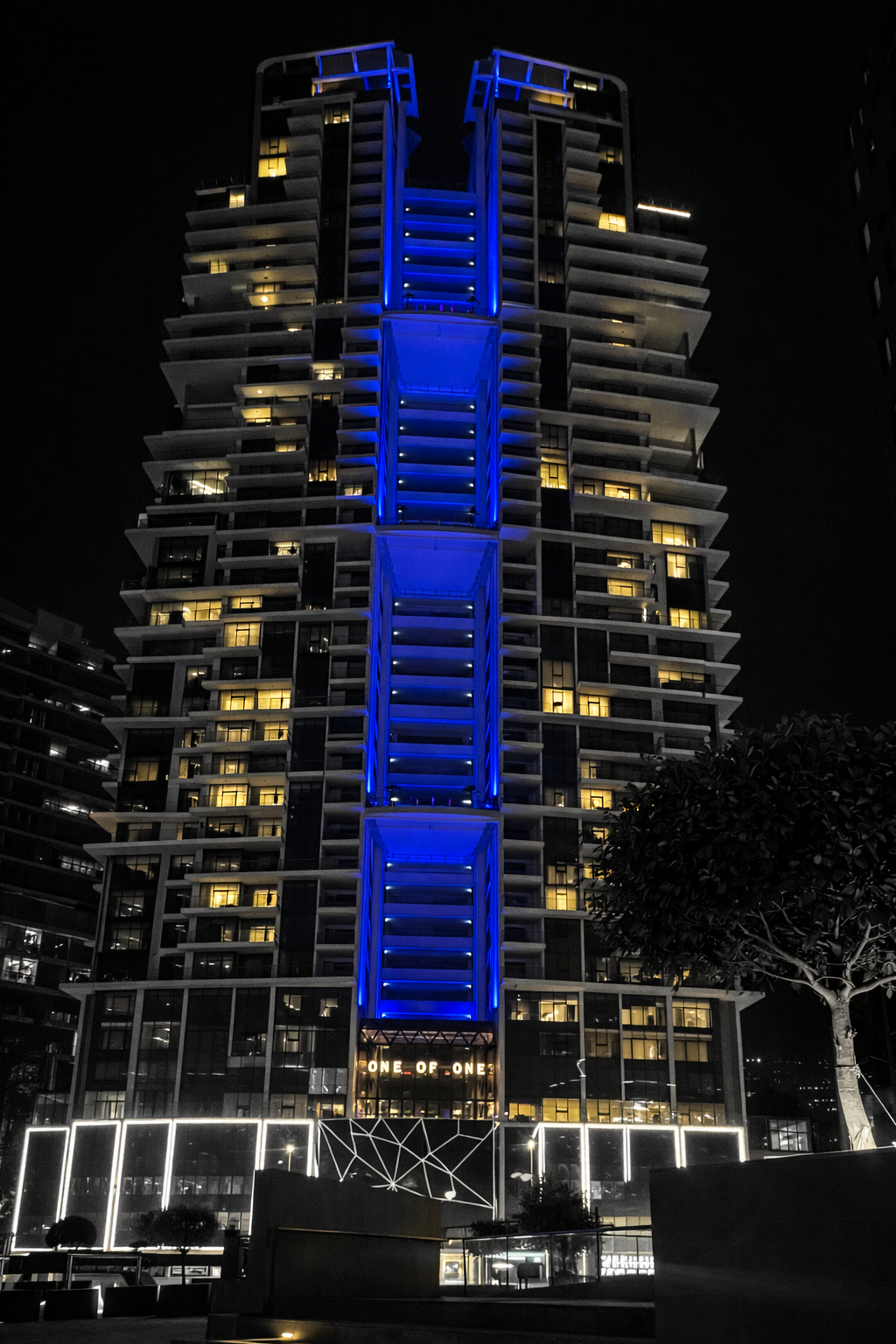 One of One Luxury Residences RGBW facade lighting at night, Business Bay Dubai